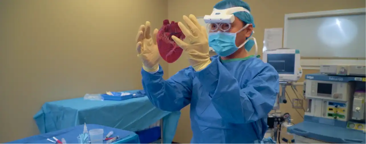 Surgeon holding a virtual heart
