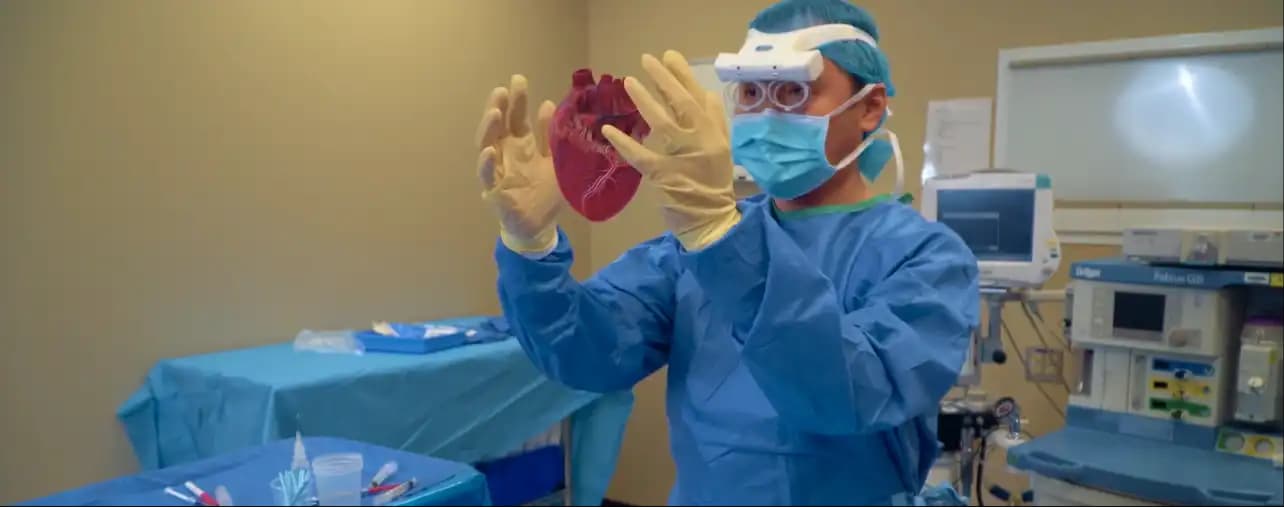 Surgeon holding a virtual heart